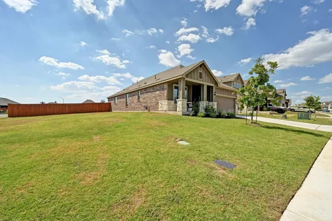 a view of a house with a big yard