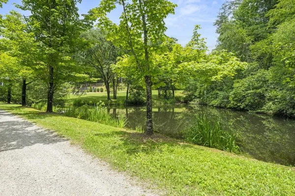 a dinning area with furniture and view of kitchen