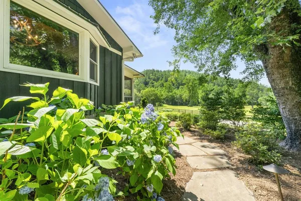 a bathroom with a sink a mirror and a shower
