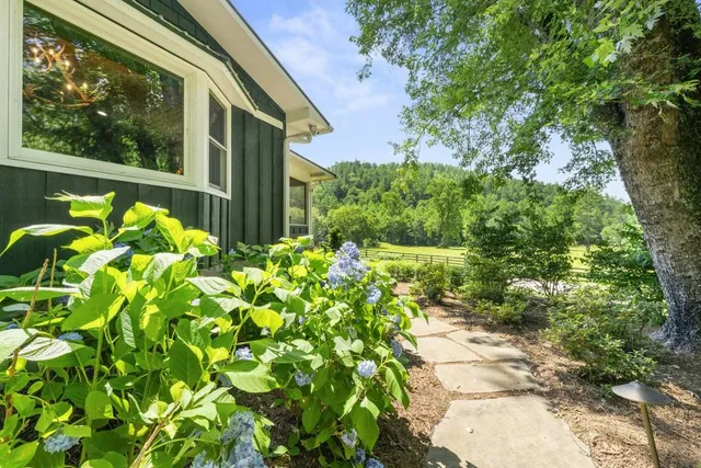 a bathroom with a sink a mirror and a shower