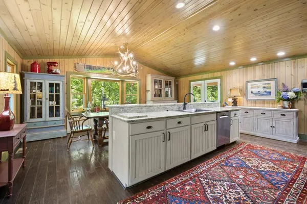a bedroom with furniture or couch and a flat screen tv
