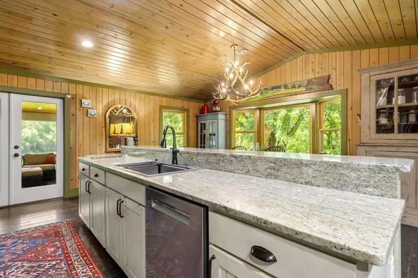 a spacious bedroom with a large bed and a large window