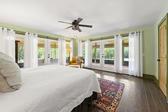 a view of a patio with swimming pool table and chairs