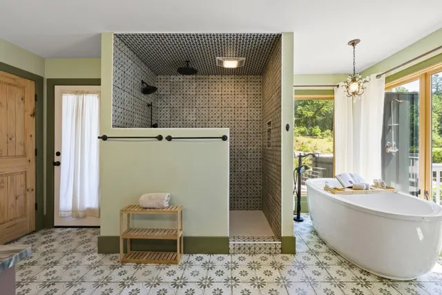 a view of a patio with table and chairs and wooden floor