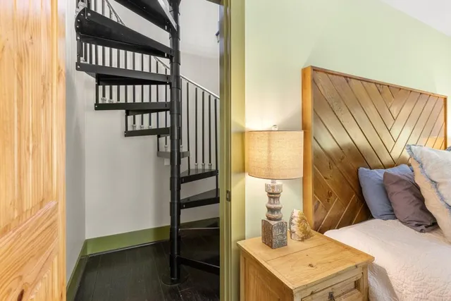 a bathroom with a toilet a sink and a mirror