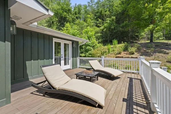 a backyard of a house with lots of green space and fountain