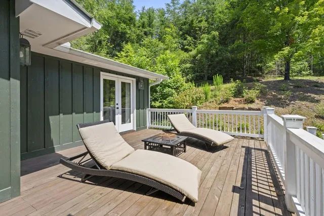 a backyard of a house with lots of green space and fountain