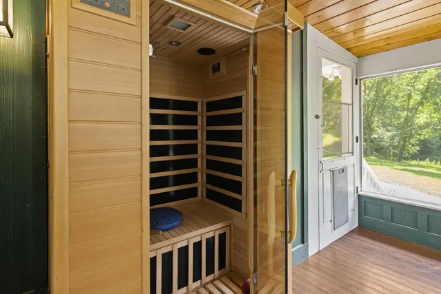 a view of a house with a yard and sitting area