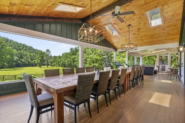 a view of a dining room with furniture window and wooden floor
