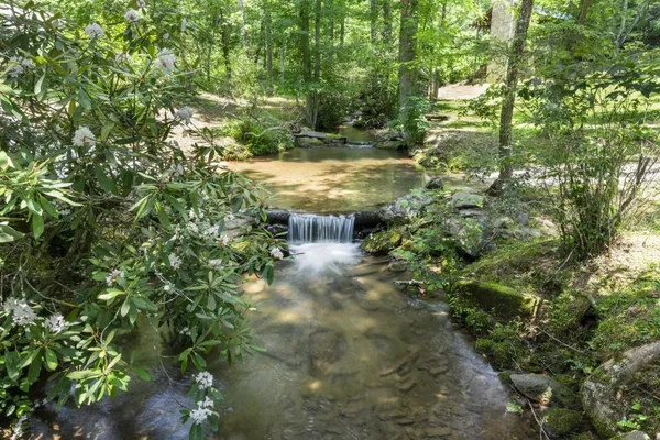 a view of a house with backyard porch and sitting area