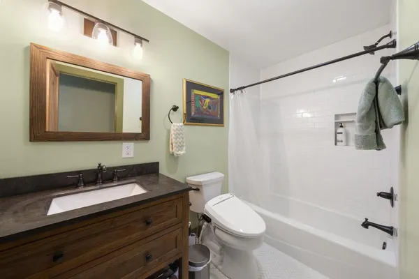 a kitchen with stainless steel appliances granite countertop a sink and cabinets
