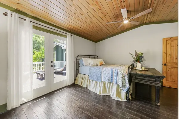 a view of a house with a backyard and balcony