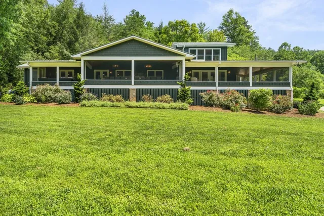 a view of a city with lush green forest