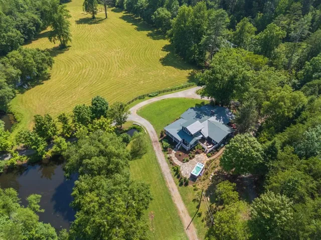 a view of a lush green hillside and a building