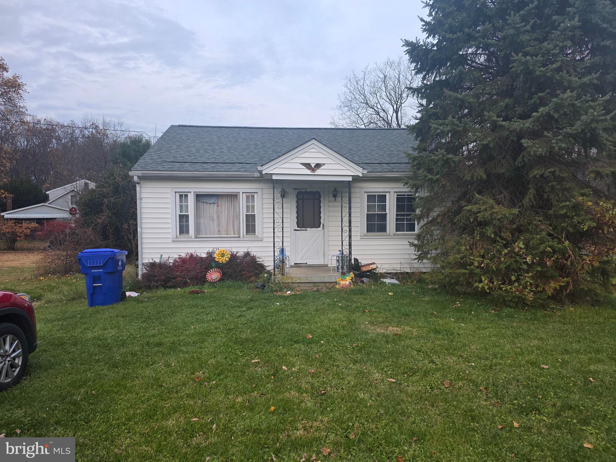 12245 Loop Road Fayetteville, PA 17222 - Photo 1 of 25 a front view of a house with a garden