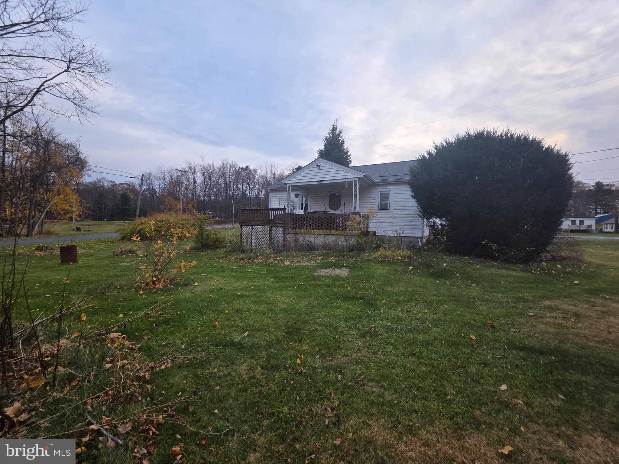 12245 Loop Road Fayetteville, PA 17222 - Photo 7 of 25 a view of a big yard next to a building