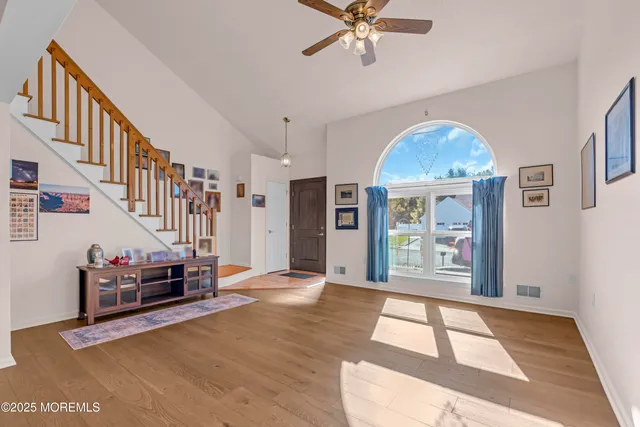 a view of an entryway with wooden floor