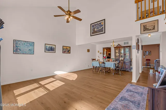 a view of a livingroom with furniture and a workspace