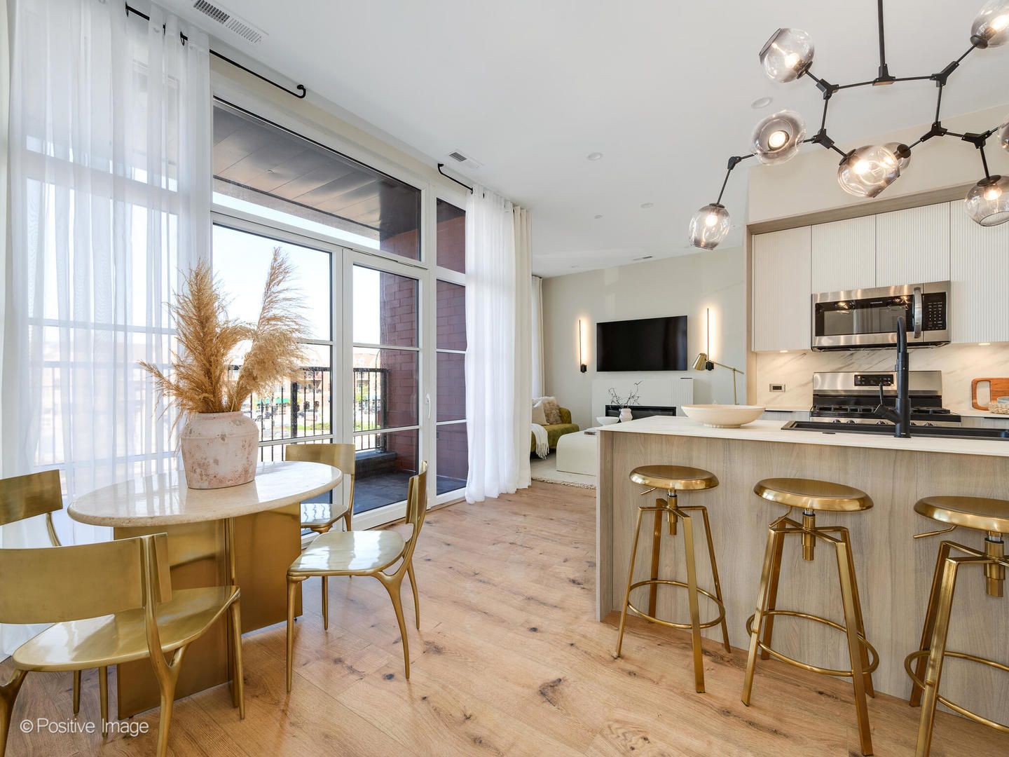 11 West Prospect Avenue, Unit 503 Mount Prospect, IL 60056 - Photo 5 of 72 a view of a dining room with furniture and a flat screen tv