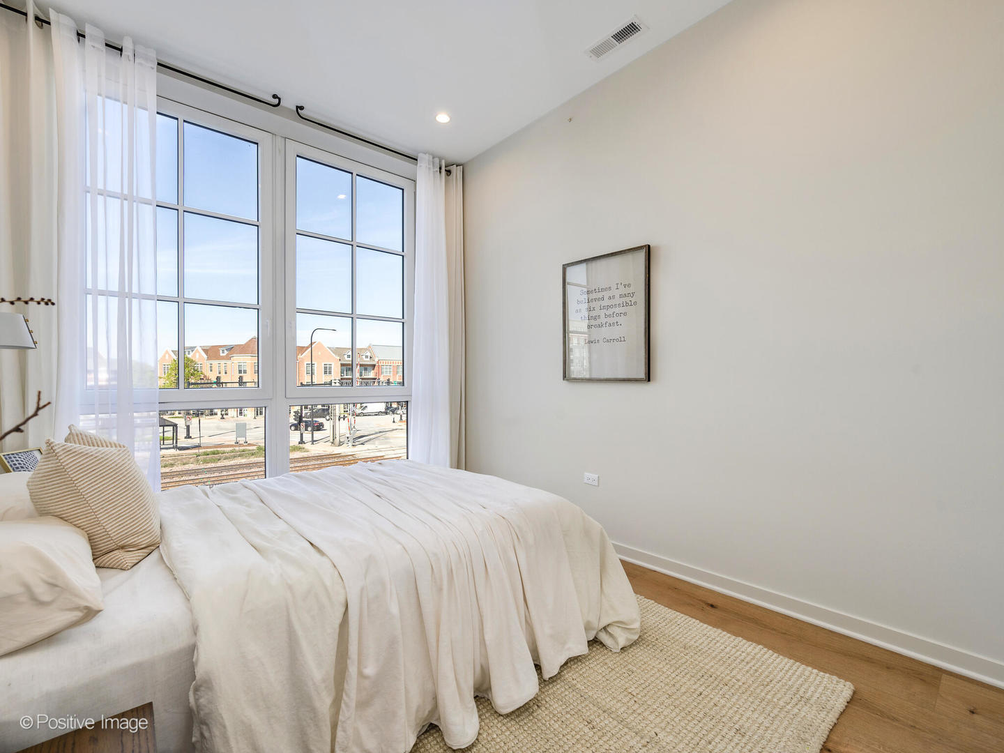 11 West Prospect Avenue, Unit 503 Mount Prospect, IL 60056 - Photo 10 of 72 a bedroom with a bed and a window