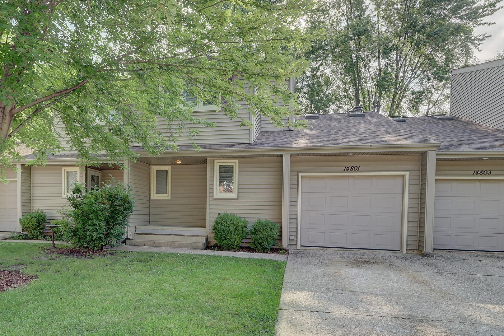 14801 South Penn Road Plainfield, IL 60544 - Photo 1 of 18 a front view of a house with a garden