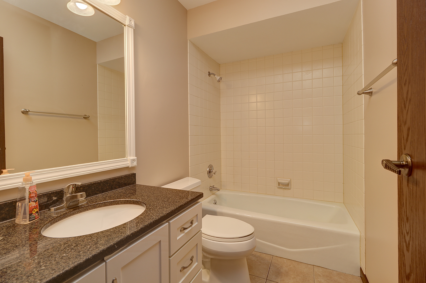 14801 South Penn Road Plainfield, IL 60544 - Photo 15 of 18 a bathroom with a granite countertop sink toilet and shower