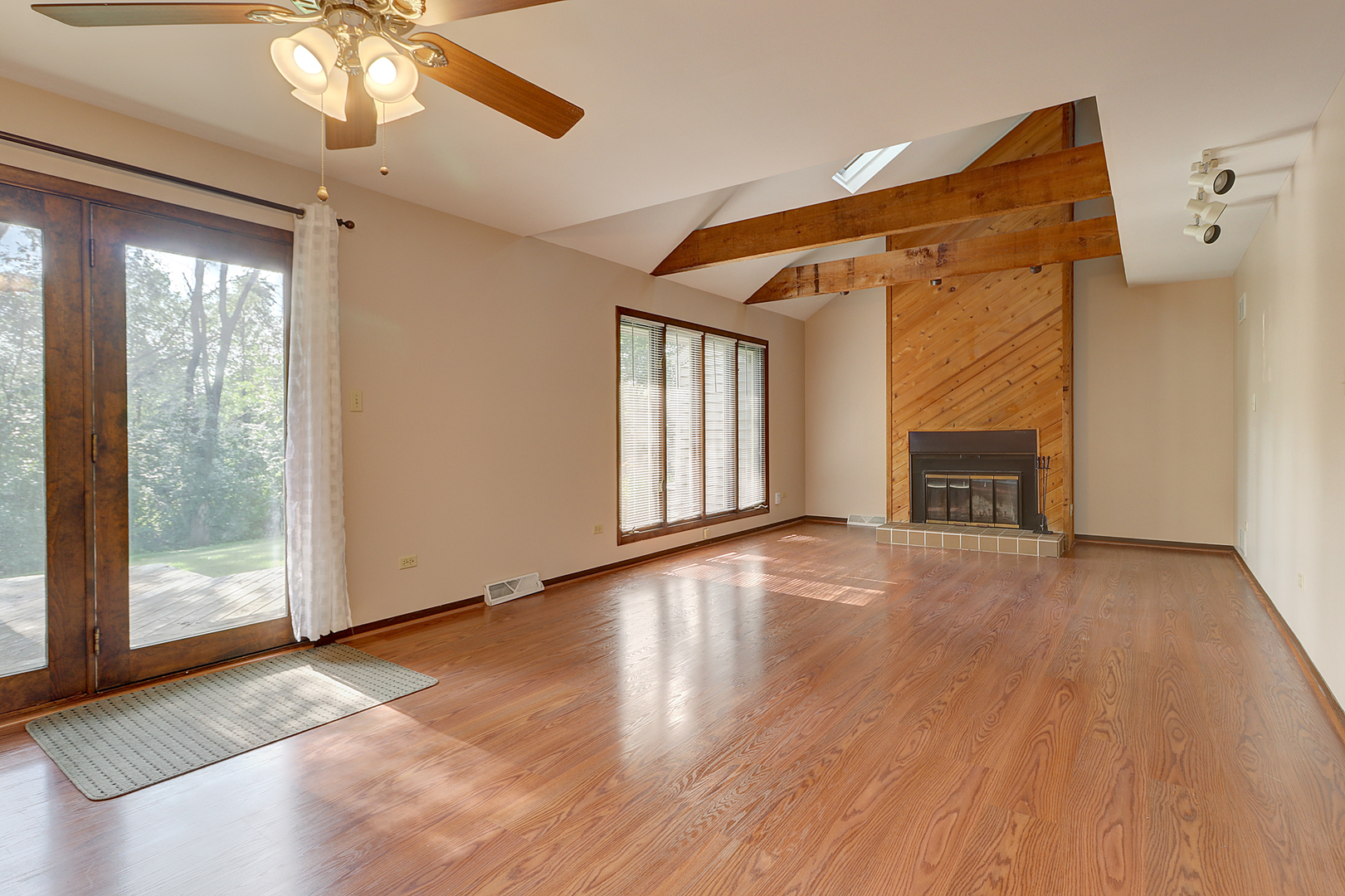14801 South Penn Road Plainfield, IL 60544 - Photo 2 of 18 a view of an empty room with wooden floor and a window