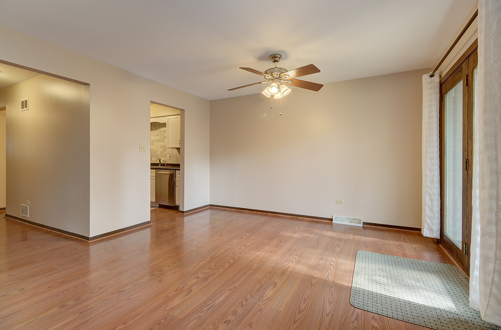 14801 South Penn Road Plainfield, IL 60544 - Photo 7 of 18 wooden floor in an empty room with a window