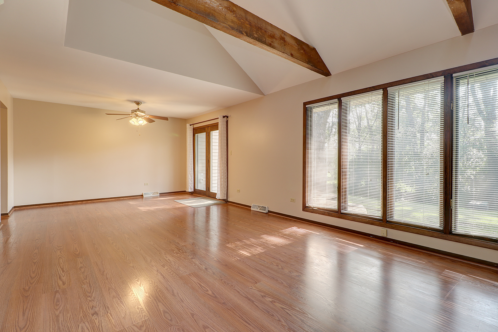 14801 South Penn Road Plainfield, IL 60544 - Photo 9 of 18 a view of an empty room with wooden floor and a window