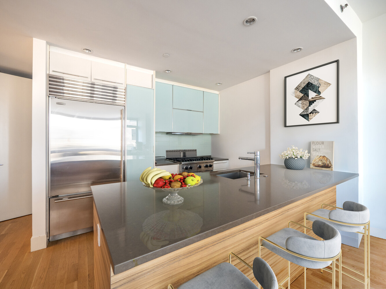 117 West 123rd Street, Unit 5D Manhattan, NY 10027 - Photo 2 of 11 a kitchen with stainless steel appliances granite countertop a refrigerator and a stove