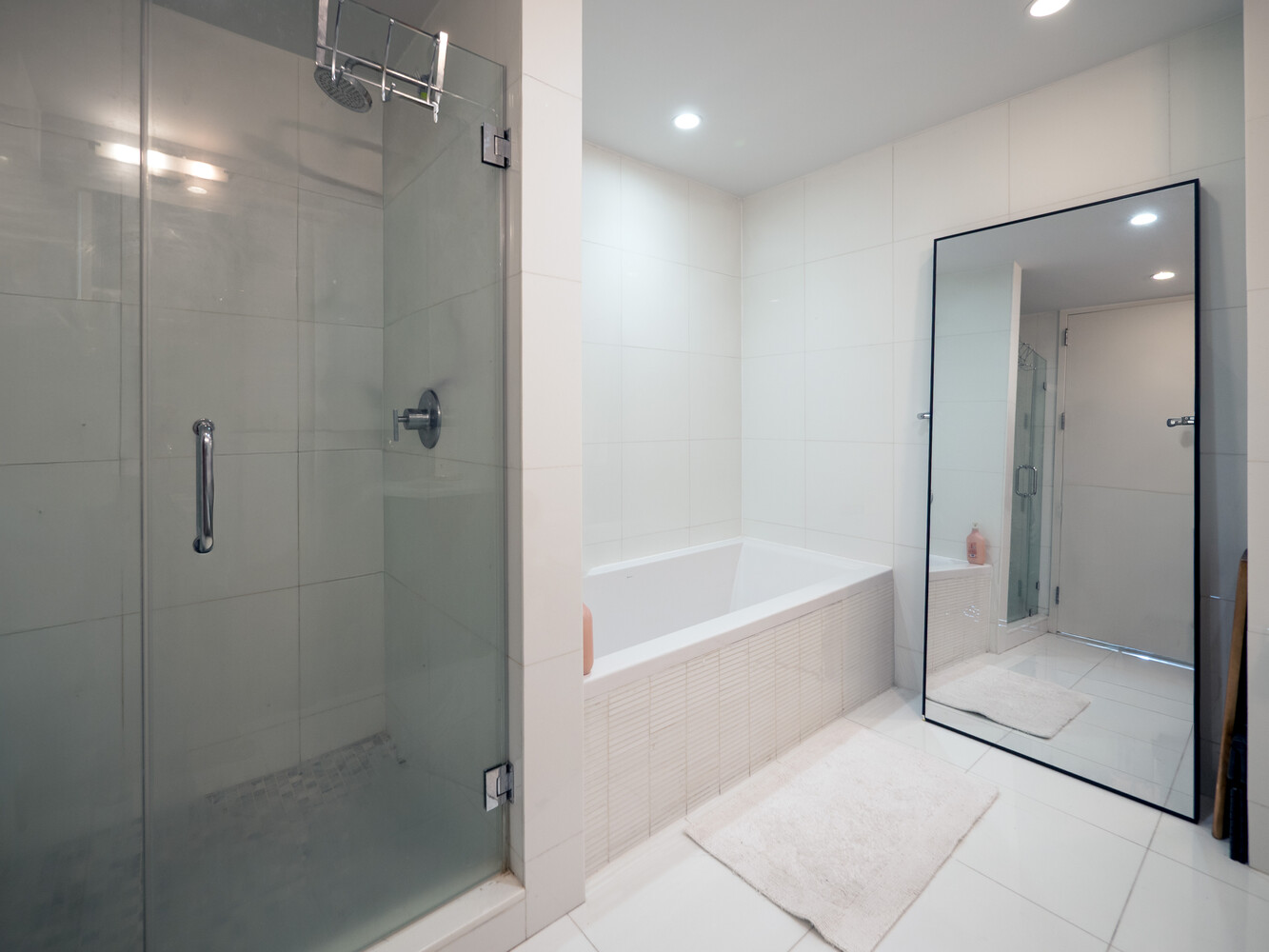 117 West 123rd Street, Unit 5D Manhattan, NY 10027 - Photo 5 of 11 a bathroom with a bathtub and a shower