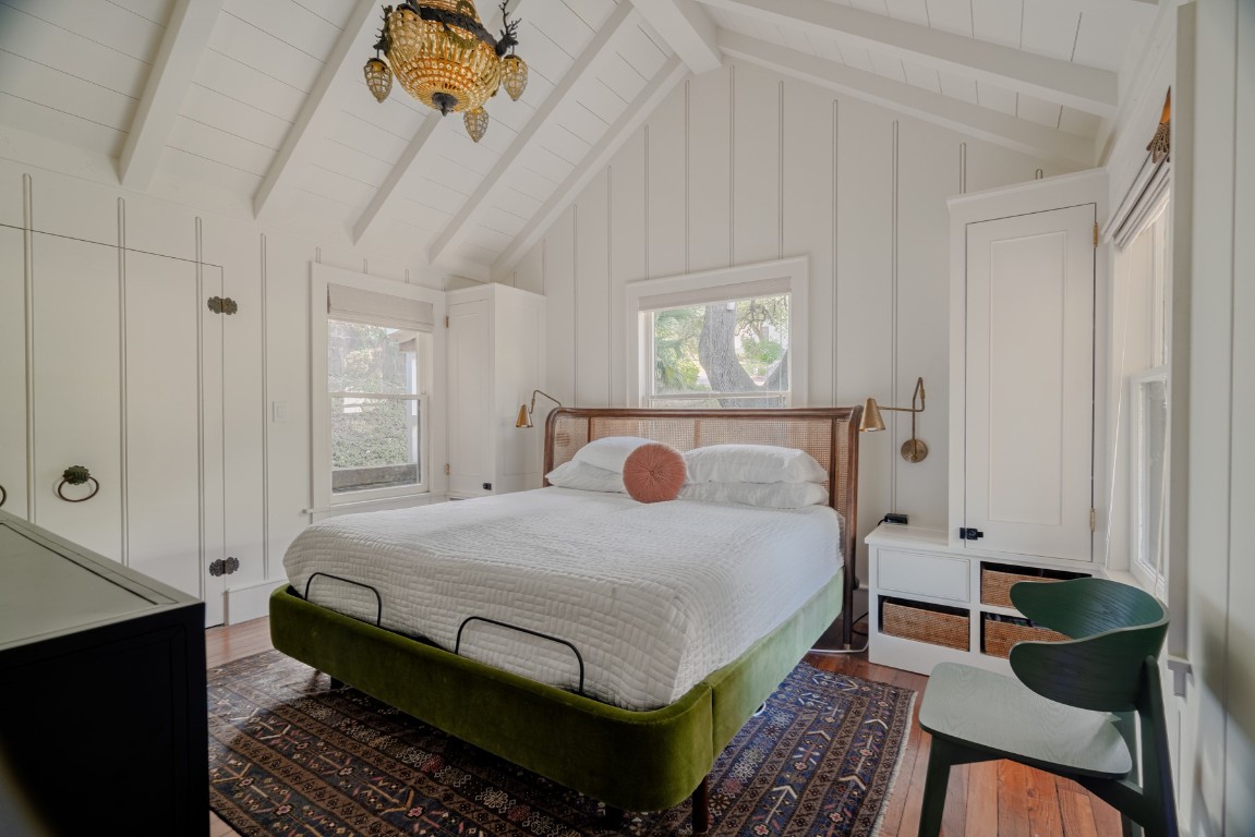 904 Avondale Road Austin, TX 78704 - Photo 13 of 16 a bedroom with a bed and a chandelier