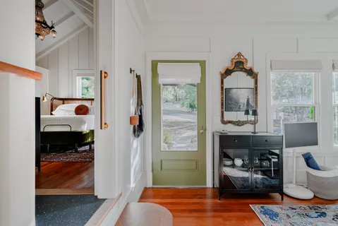 a bedroom with furniture and a window