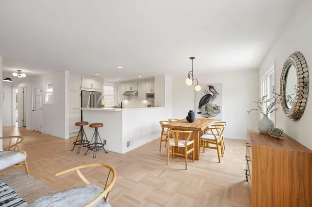 a view of a kitchen and dining room