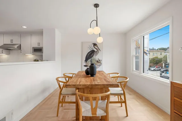 a dining room with furniture and window