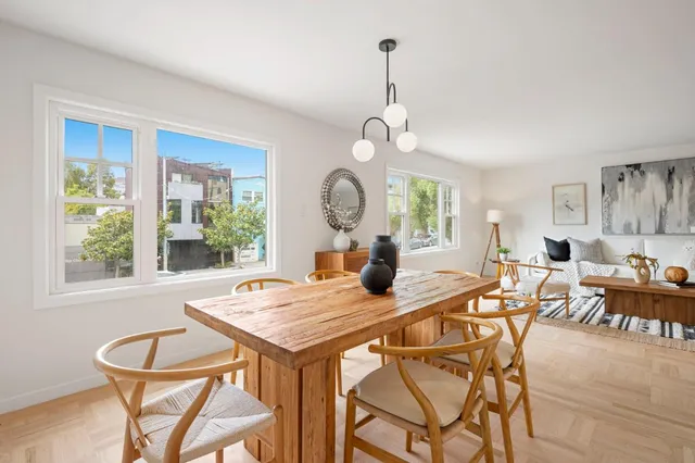 a view of a dining room with furniture window and wooden floor