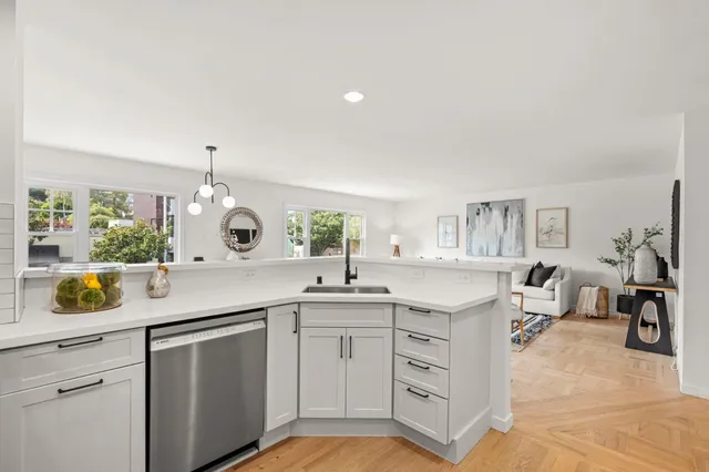 a kitchen with a sink and cabinets