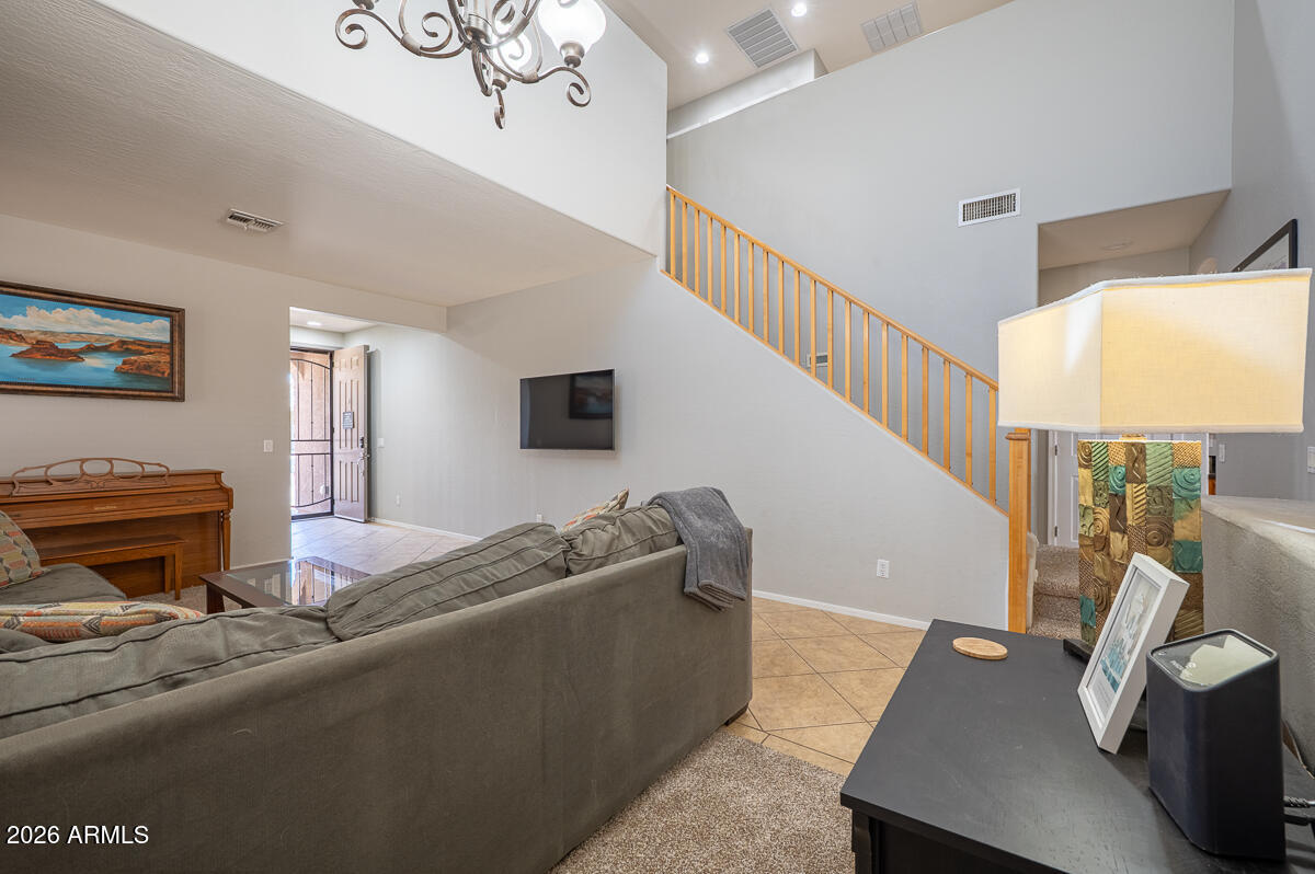 3328 East Merlot Street Gilbert, AZ 85298 - Photo 17 of 48 a living room with furniture and a flat screen tv