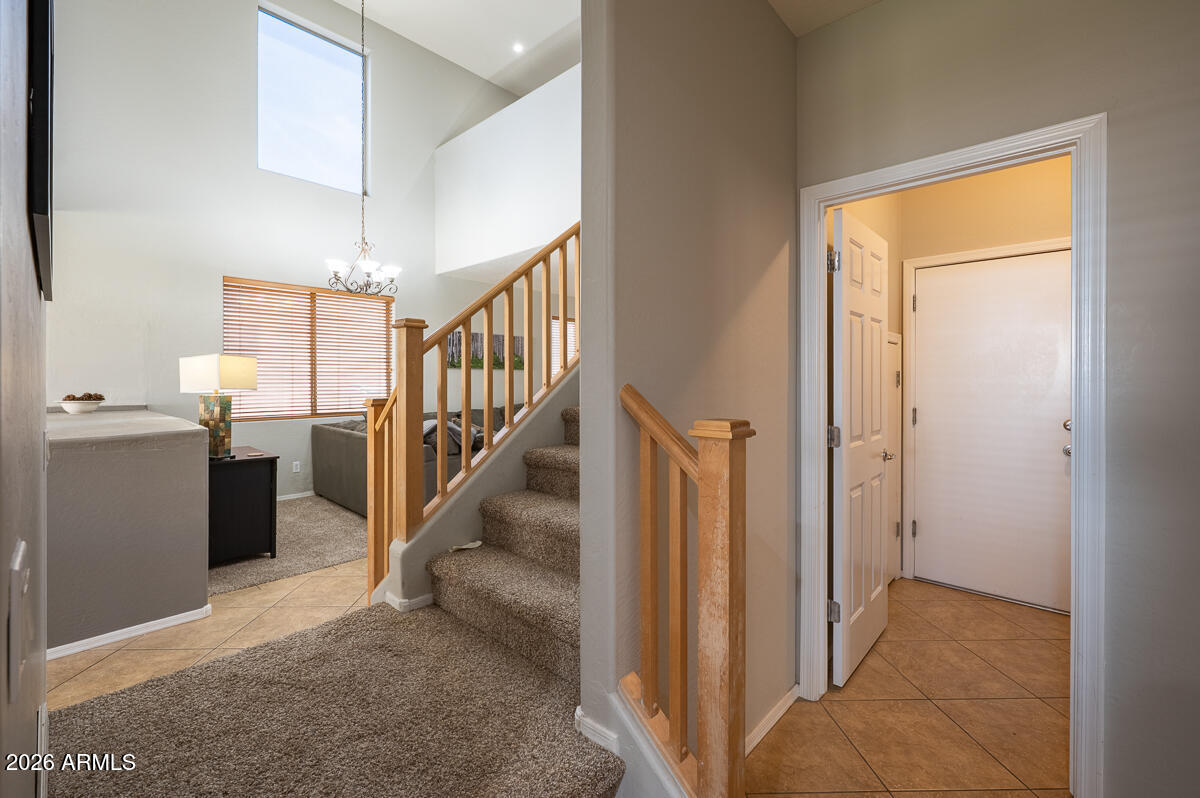3328 East Merlot Street Gilbert, AZ 85298 - Photo 18 of 48 a view of a hallway with entryway and stairs