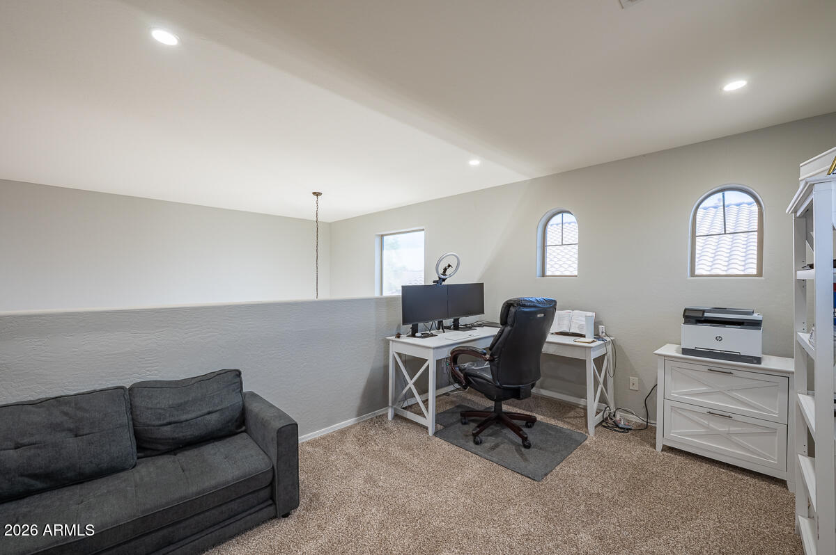 3328 East Merlot Street Gilbert, AZ 85298 - Photo 20 of 48 a work room with furniture and a wooden floor