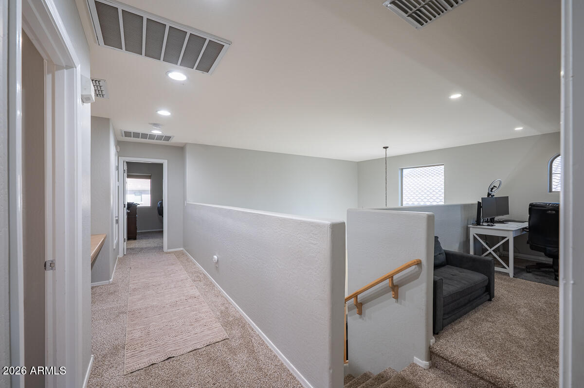 3328 East Merlot Street Gilbert, AZ 85298 - Photo 22 of 48 a view of a hallway