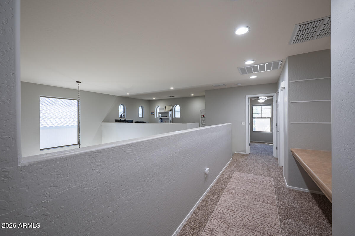 3328 East Merlot Street Gilbert, AZ 85298 - Photo 23 of 48 an empty room with windows and entrance