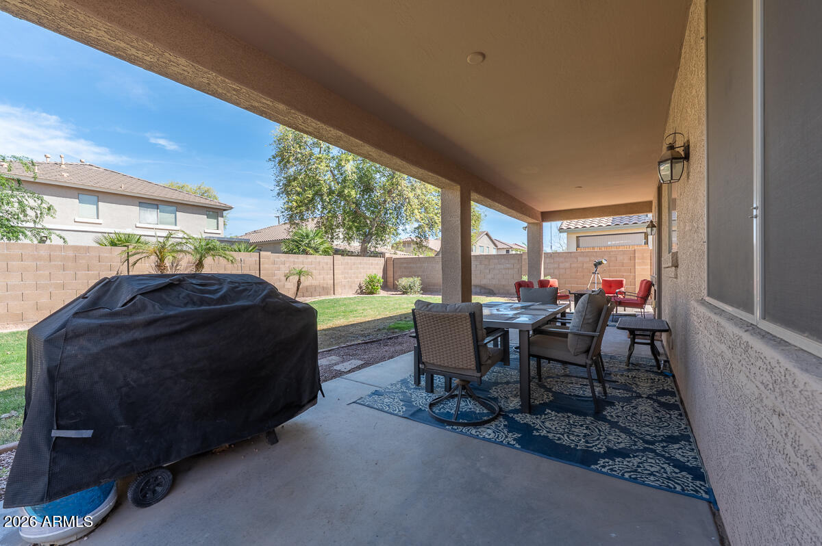 3328 East Merlot Street Gilbert, AZ 85298 - Photo 46 of 48 a living room with furniture and a large window