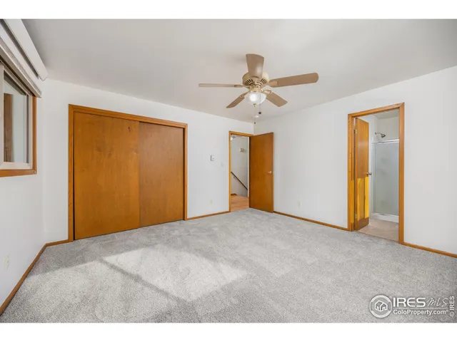 a bathroom with a sink a mirror and a picture on the wall
