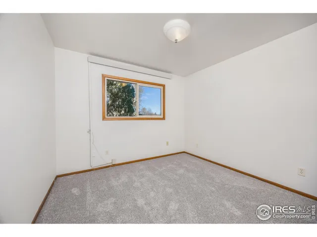 a bathroom with a sink mirror and a toilet