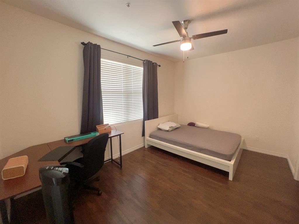 1100 West Trinity Mills Road, Unit 3015 Carrollton, TX 75006 - Photo 14 of 17 a room with a desk and a window