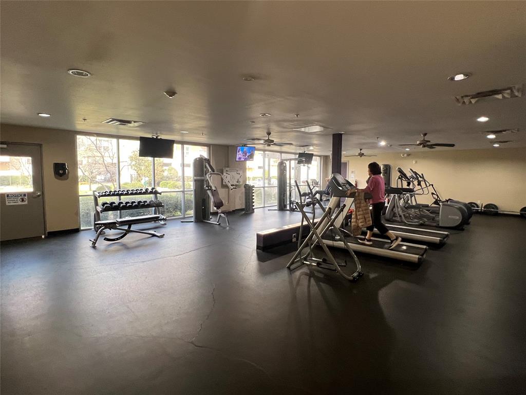 1100 West Trinity Mills Road, Unit 3015 Carrollton, TX 75006 - Photo 4 of 17 a view of a room with gym equipment