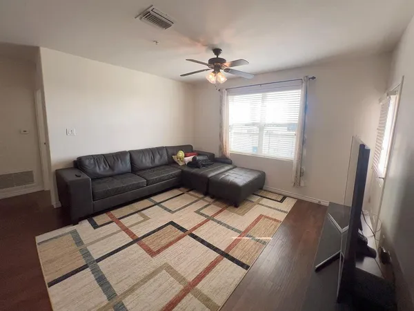 a living room with furniture and a window