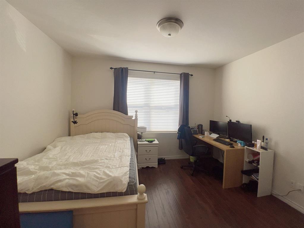 1100 West Trinity Mills Road, Unit 3015 Carrollton, TX 75006 - Photo 10 of 17 a bedroom with a bed and a window