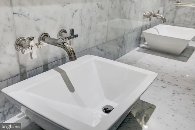 a bathroom with a tub and a sink